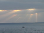SX01274 Sunrays over small boat on sea.jpg